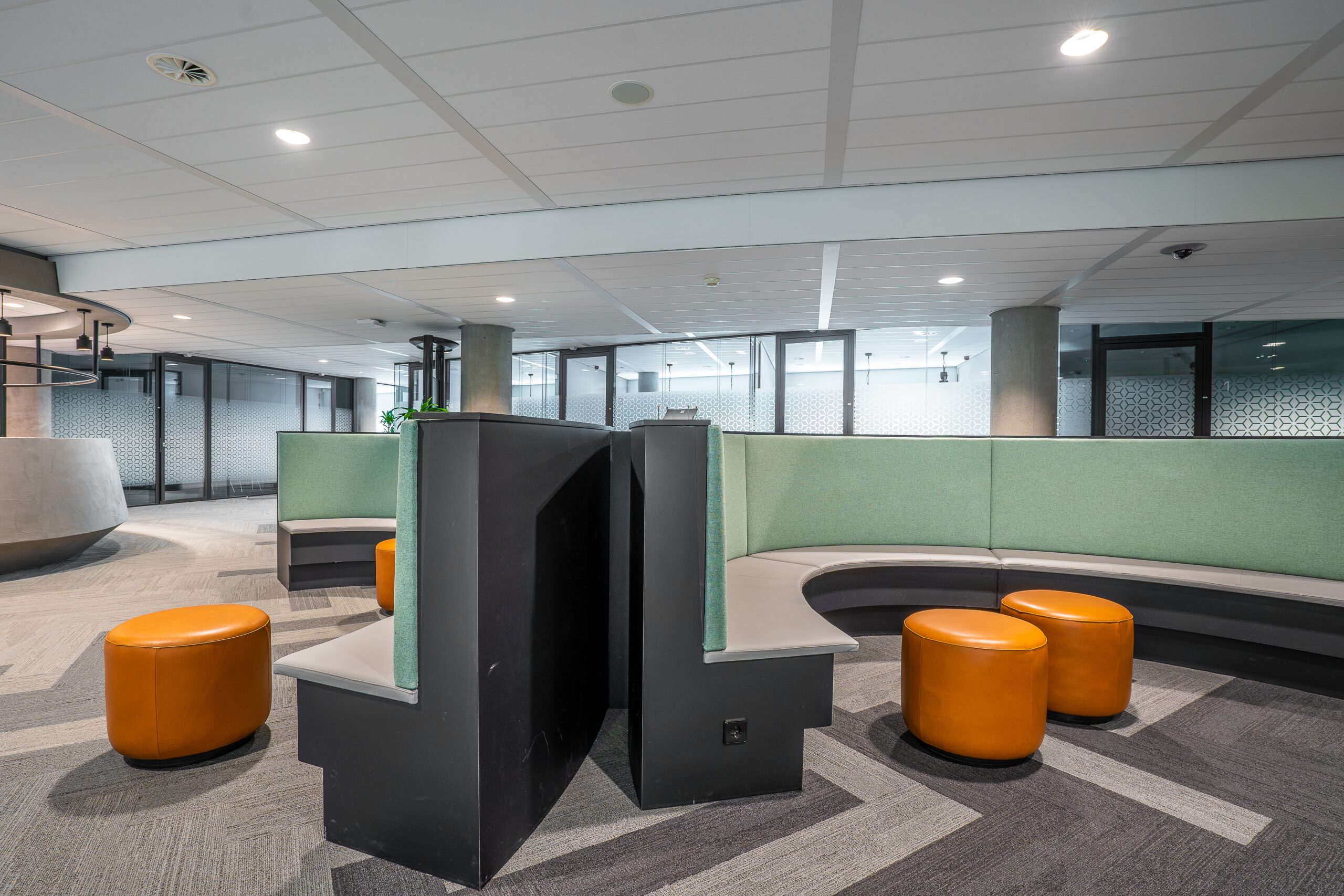 Interior view of a modern open-space corporate office highlighting the physical headquarters environment.